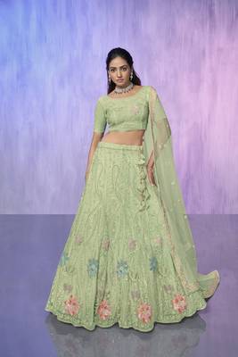 green heavy work lehenga with vibrant blouse and contrast dupatta 1