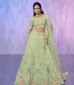 green heavy work lehenga with vibrant blouse and contrast dupatta
