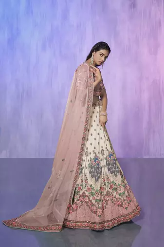 white heavy work lehenga with vibrant blouse and contrast dupatta