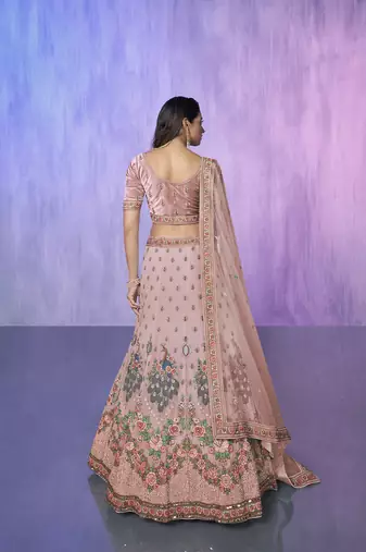 peach heavy work lehenga with vibrant blouse and contrast dupatta