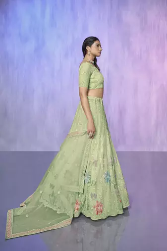 green heavy work lehenga with vibrant blouse and contrast dupatta