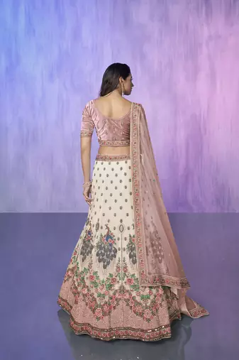 white heavy work lehenga with vibrant blouse and contrast dupatta