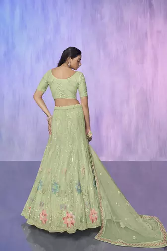 green heavy work lehenga with vibrant blouse and contrast dupatta