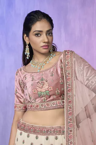 white heavy work lehenga with vibrant blouse and contrast dupatta