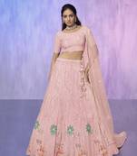 peach heavy work lehenga with vibrant blouse and contrast dupatta