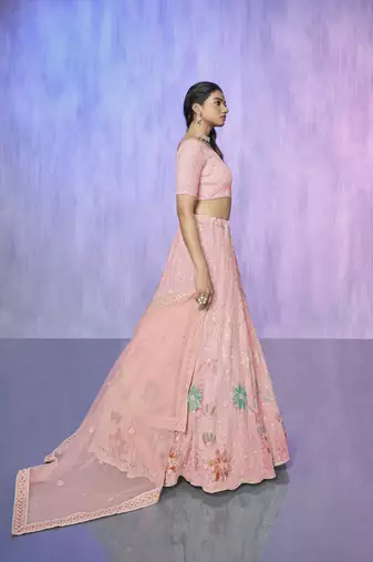 peach heavy work lehenga with vibrant blouse and contrast dupatta