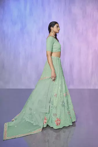blue heavy work lehenga with vibrant blouse and contrast dupatta