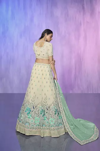 white heavy work lehenga with vibrant blouse and contrast dupatta