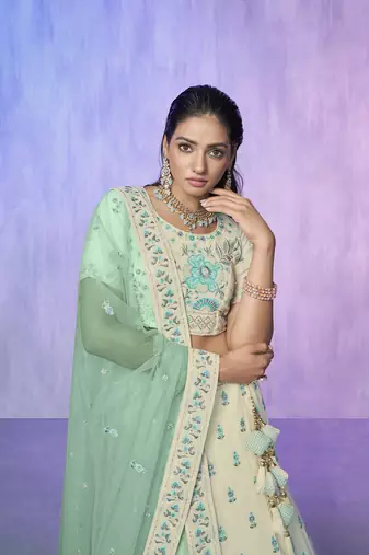 white heavy work lehenga with vibrant blouse and contrast dupatta