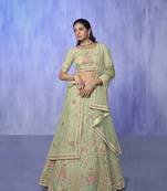 green heavy work lehenga with vibrant blouse and contrast dupatta