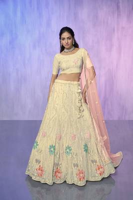 white heavy work lehenga with vibrant blouse and contrast matching dupatta 1