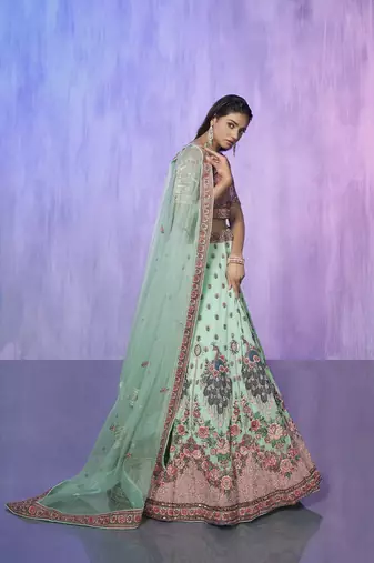 blue heavy work lehenga with vibrant blouse and contrast dupatta