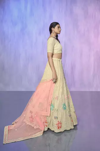 white heavy work lehenga with vibrant blouse and contrast matching dupatta