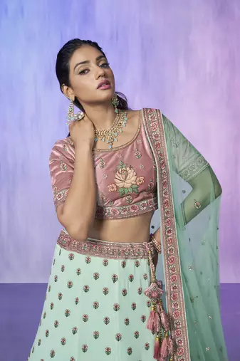 blue heavy work lehenga with vibrant blouse and contrast dupatta
