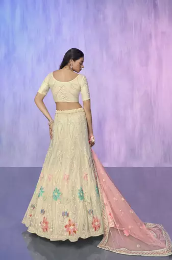 white heavy work lehenga with vibrant blouse and contrast matching dupatta