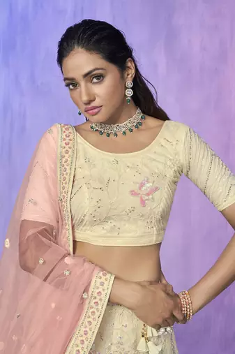 white heavy work lehenga with vibrant blouse and contrast matching dupatta