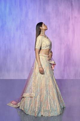 white heavy work lehenga with vibrant blouse and contrast dupatta 2