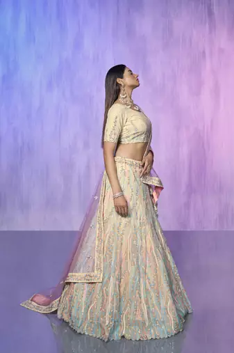 white heavy work lehenga with vibrant blouse and contrast dupatta