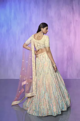 white heavy work lehenga with vibrant blouse and contrast dupatta
