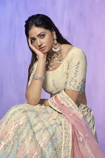 white heavy work lehenga with vibrant blouse and contrast dupatta