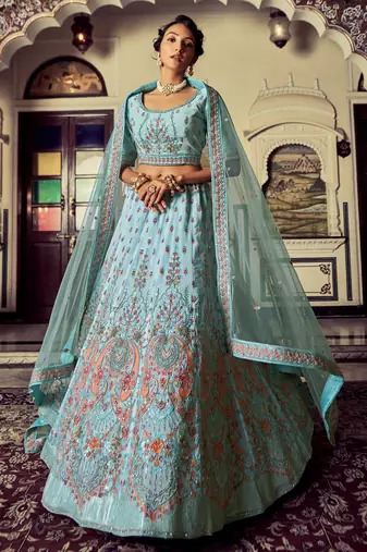 Aqua color heavy embroidered lehenga choli set.
