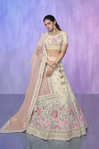 white heavy work lehenga with vibrant blouse and contrast dupatta