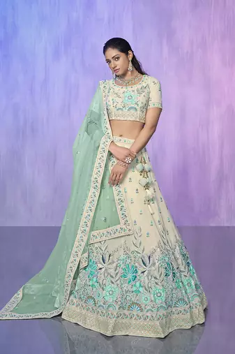 white heavy work lehenga with vibrant blouse and contrast dupatta