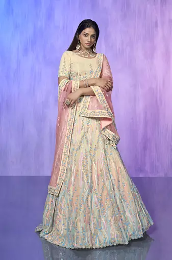 white heavy work lehenga with vibrant blouse and contrast dupatta