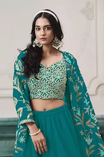 Embroidered faux georgette teal readymade salwar kameez with shrug