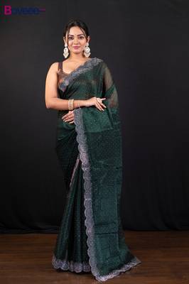 Dark green jimmy choo saree with intricate silver embellishments and beautiful curve border 1