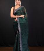 Dark green jimmy choo saree with intricate silver embellishments and beautiful curve border