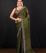 Moss green jimmy choo saree with intricate silver embellishments and beautiful curve border