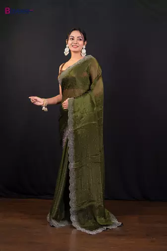 Moss green jimmy choo saree with intricate silver embellishments and beautiful curve border