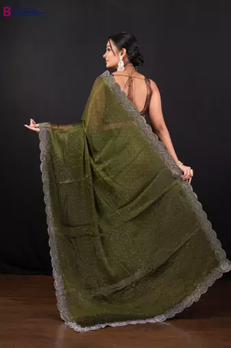 Moss green jimmy choo saree with intricate silver embellishments and beautiful curve border