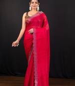 Red jimmy choo saree with intricate silver embellishments and beautiful curve border
