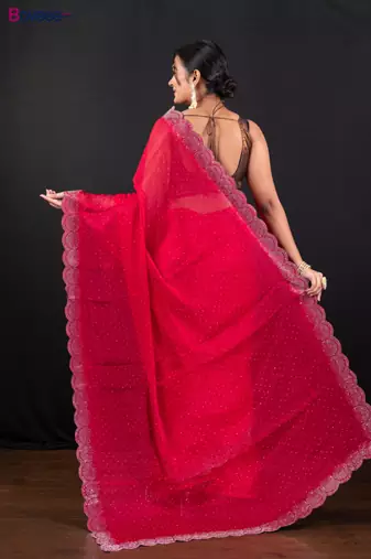 Red jimmy choo saree with intricate silver embellishments and beautiful curve border
