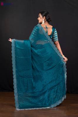 Teal blue jimmy choo saree with intricate silver embellishments and beautiful curve border 3