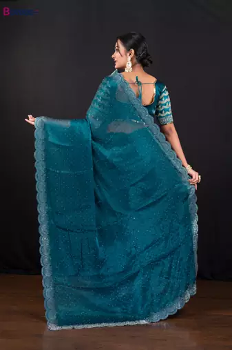 Teal blue jimmy choo saree with intricate silver embellishments and beautiful curve border