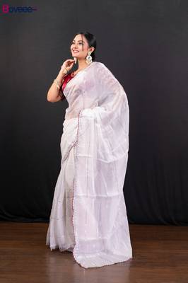 White jimmy choo saree adorned with intricate silver embellishments and a beautifully detailed border with ready blouse 2