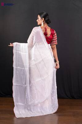 White jimmy choo saree adorned with intricate silver embellishments and a beautifully detailed border with ready blouse 3