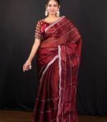Maroon jimmy choo saree adorned with intricate silver embellishments and a beautifully detailed border with ready blouse