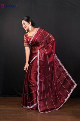 Maroon jimmy choo saree adorned with intricate silver embellishments and a beautifully detailed border with ready blouse 2