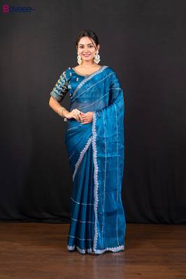 Blue jimmy choo saree adorned with intricate silver embellishments and a beautifully detailed border with ready blouse 1