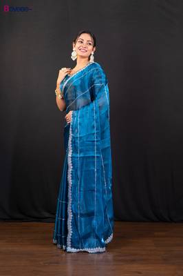 Blue jimmy choo saree adorned with intricate silver embellishments and a beautifully detailed border with ready blouse 2