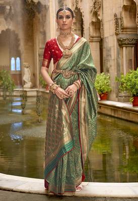 Banarasi silk blend jacquard work saree in green 1