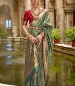 Banarasi silk blend jacquard work saree in green