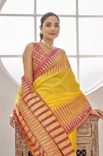 yellow banarasi soft silk blend woven saree with heavy jacquard work and blouse piece