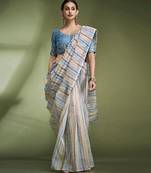 Earthy striped crushed tissue saree