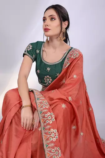 Rust orange art silk saree with embroidered border