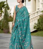 Women's turquoise silk blend printed saree with unstitched blouse piece